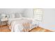 Airy bedroom filled with light, featuring a comfortable bed and a stylish bedside table at 3346 W 30Th Ave, Denver, CO 80211