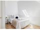 Cozy bedroom featuring a bright skylight and a comfortable bed with stylish decor at 3346 W 30Th Ave, Denver, CO 80211