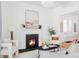 Cozy living room with an ornate fireplace, modern decor, and lots of light at 3346 W 30Th Ave, Denver, CO 80211