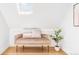 Hallway landing featuring a skylight, stylish seating, and bright natural light at 3346 W 30Th Ave, Denver, CO 80211
