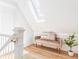 Bright hallway landing featuring a skylight and stylish seating at 3346 W 30Th Ave, Denver, CO 80211