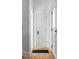 Hallway featuring hardwood floors and decorative moldings on the bright white doors and trim at 3346 W 30Th Ave, Denver, CO 80211