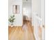 Hallway with hardwood floors leading to the bright main bedroom at 3346 W 30Th Ave, Denver, CO 80211