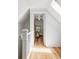 Inviting hallway with gleaming hardwood floors leading to a bright and airy bedroom at 3346 W 30Th Ave, Denver, CO 80211