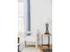 Living room space with a window, a chair, and a stylish side table at 3346 W 30Th Ave, Denver, CO 80211