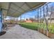 Backyard featuring a covered patio, green grass, a detached shed, and metal border fencing at 2166 S Golden Ct, Denver, CO 80227