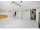 Finished basement featuring tiled floors, a bar area, laundry room, and ample storage at 2166 S Golden Ct, Denver, CO 80227