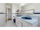 Bathroom with double sink and tile floor at 2166 S Golden Ct, Denver, CO 80227