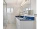 Bathroom with dual sinks, a walk-in shower and new tiled floor at 2166 S Golden Ct, Denver, CO 80227