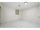A simple bedroom featuring white walls and tile flooring, with an overhead light fixture at 2166 S Golden Ct, Denver, CO 80227