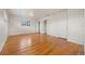 This bedroom has hardwood floors, natural light, and a door with coat hooks on the back at 2166 S Golden Ct, Denver, CO 80227
