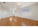 Sun-filled bedroom offering hardwood floors, two large windows, and white walls at 2166 S Golden Ct, Denver, CO 80227