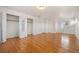 Spacious bedroom with natural wood flooring and multiple closets with double doors at 2166 S Golden Ct, Denver, CO 80227