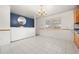 A view of the Dining Room, with light walls, a round mirror and chandelier at 2166 S Golden Ct, Denver, CO 80227