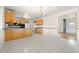 View of a tile floor kitchen with wood cabinets and lots of counter space at 2166 S Golden Ct, Denver, CO 80227