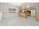 Spacious eat-in kitchen with tile floors, window, and wood cabinets with lots of counter space at 2166 S Golden Ct, Denver, CO 80227