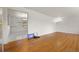 Bright living room featuring gleaming hardwood floors, and large pass through to the adjacent room at 2166 S Golden Ct, Denver, CO 80227