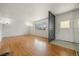 Spacious living room featuring gleaming hardwood floors and abundant natural light at 2166 S Golden Ct, Denver, CO 80227