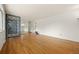 Bright living room featuring gleaming hardwood floors, decorative screen, and ample open space at 2166 S Golden Ct, Denver, CO 80227