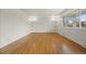 Bright living room featuring gleaming hardwood floors, modern lighting, and lots of natural light at 2166 S Golden Ct, Denver, CO 80227