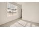 Bright bedroom featuring neutral carpet, a large window offering plenty of natural light, and fresh paint at 2050 S Haleyville Way, Aurora, CO 80018