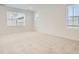Neutral bedroom features plush carpet, ample natural light from large windows, and fresh paint at 2050 S Haleyville Way, Aurora, CO 80018