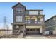 Charming two-story home with stone accents and a welcoming covered porch and a spacious garage at 2050 S Haleyville Way, Aurora, CO 80018