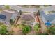 Aerial view of a landscaped backyard with a deck and lush green lawn at 13664 Cherry St, Thornton, CO 80602