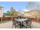 Back deck with dining table and seating, perfect for entertaining or relaxing outdoors at 13664 Cherry St, Thornton, CO 80602