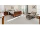Relaxing bedroom with a sleigh bed, chair, and ample natural light at 13664 Cherry St, Thornton, CO 80602