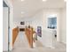 Second story hallway with wooden railing and trim, and doors to other bedrooms at 13664 Cherry St, Thornton, CO 80602