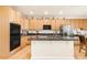 Lovely kitchen with wooden cabinets, granite countertops, and modern stainless steel appliances at 13664 Cherry St, Thornton, CO 80602