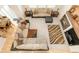 Open concept living room with fireplace, neutral colored walls, and sofa seating at 13664 Cherry St, Thornton, CO 80602