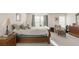 Spacious main bedroom with a comfortable bed, soft lighting, and elegant decor at 13664 Cherry St, Thornton, CO 80602