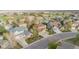 Aerial view showcases a peaceful neighborhood with well-kept lawns and mature trees at 13664 Cherry St, Thornton, CO 80602
