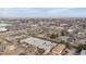 Expansive aerial view of a residential area with various buildings, streets, and visible landscape features at 2027 Terry St # 1, Longmont, CO 80501