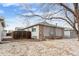 Exterior view of a house with a fenced yard, brick accents, and tidy landscaping at 2027 Terry St # 1, Longmont, CO 80501