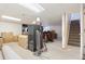 Spacious basement with carpet flooring and stairs, ready to be finished for additional living space at 2027 Terry St # 1, Longmont, CO 80501