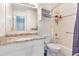 Well-maintained bathroom features white cabinets, granite countertop and a shower/tub combo at 2027 Terry St # 1, Longmont, CO 80501