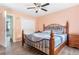 Bedroom with hardwood floors, ceiling fan, and a double door closet at 2027 Terry St # 1, Longmont, CO 80501
