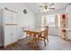 Bright dining room with wood floors, ceiling fan, and natural light perfect for entertaining at 2027 Terry St # 1, Longmont, CO 80501