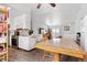 Bright kitchen with stainless steel appliances, granite countertops, and white cabinets, flowing into an adjacent dining area at 2027 Terry St # 1, Longmont, CO 80501