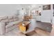 Open concept living and dining area boasts hardwood floors, neutral walls, and ample natural light at 2027 Terry St # 1, Longmont, CO 80501