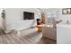 Cozy living room features hardwood floors and sliding glass doors at 2027 Terry St # 1, Longmont, CO 80501