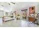 Bright bedroom with tile flooring, window with view, and stylish decor creating a comfortable and inviting space at 525 Willow Dr, Brighton, CO 80603