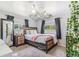 Cozy bedroom featuring soft carpet, a comfortable bed, bedside tables, and natural light at 525 Willow Dr, Brighton, CO 80603