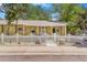 Charming single-story home with a white picket fence and a well-maintained, xeriscaped front yard at 525 Willow Dr, Brighton, CO 80603