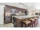 Modern kitchen featuring an island, granite countertops, updated appliances, and stylish cabinetry at 525 Willow Dr, Brighton, CO 80603