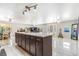 Expansive open-concept living area with marble flooring, ample light, and kitchen island view at 525 Willow Dr, Brighton, CO 80603