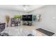 Bright living room with windows, modern flooring, comfortable seating and a sleek entertainment center at 525 Willow Dr, Brighton, CO 80603